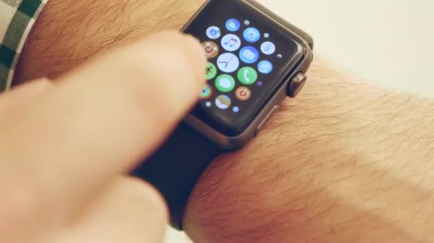 Man Using and Wearing Apple Smart Watch