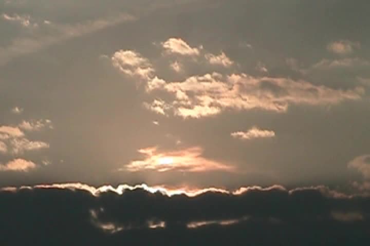 Sun Rises Over Cloud Bank