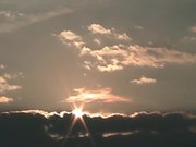 Sun Rises Over Cloud Bank
