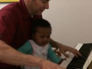 Chris and Augie Playing the Piano